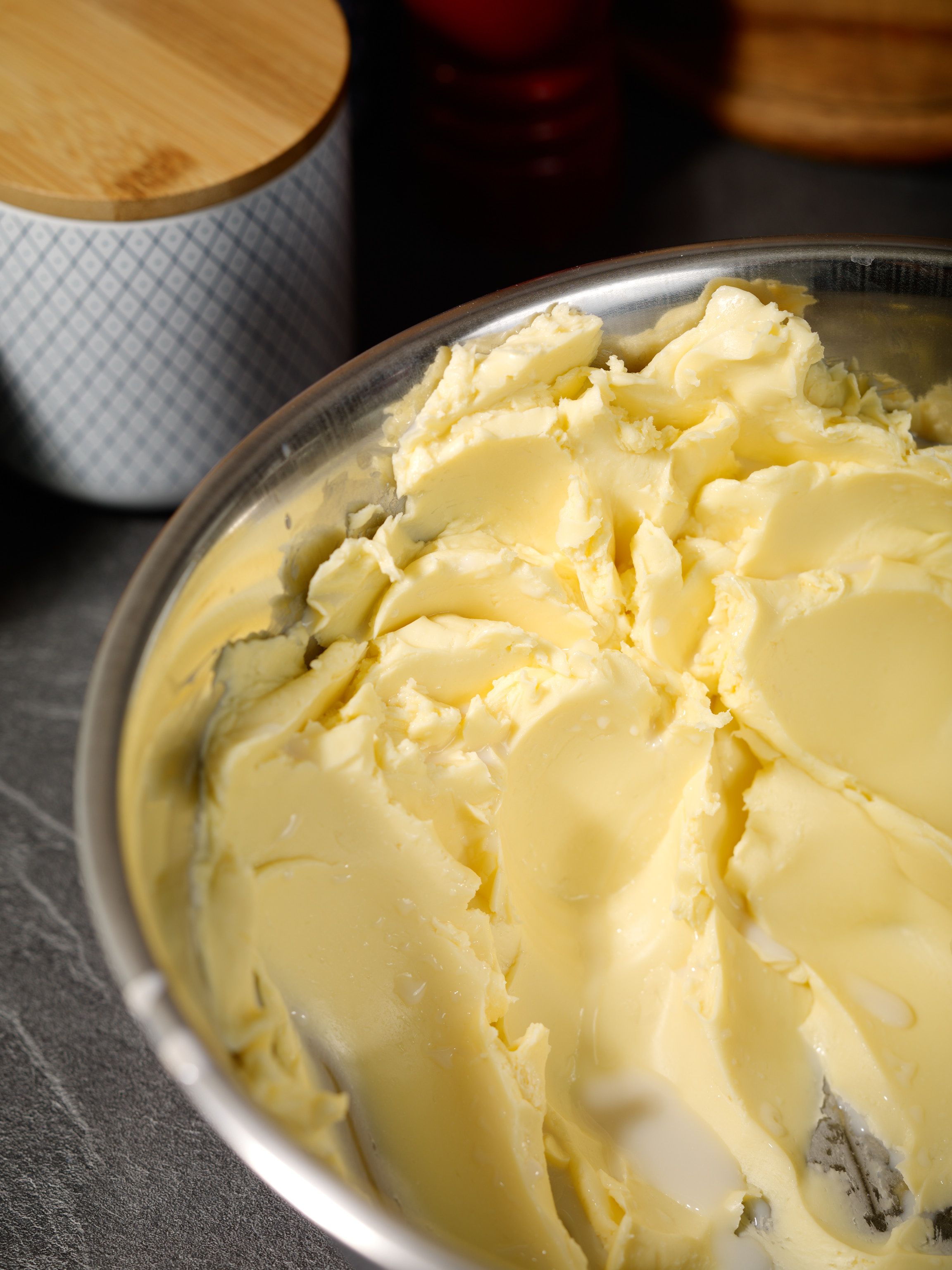 Butter in the process of being kneaded with visible drops of buttermilk