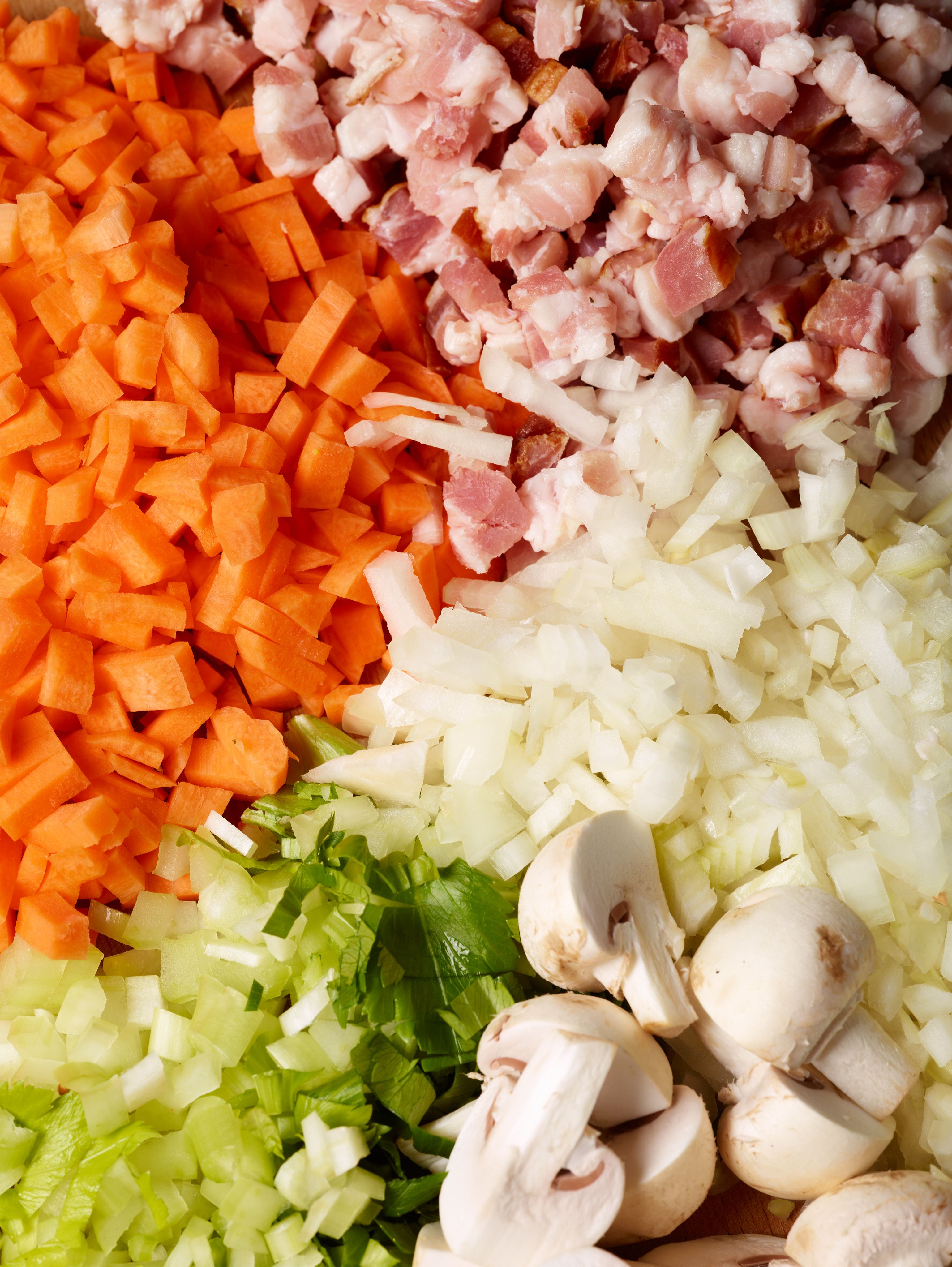 Diced carrots, ham, onions and celery as well as quartered mushrooms