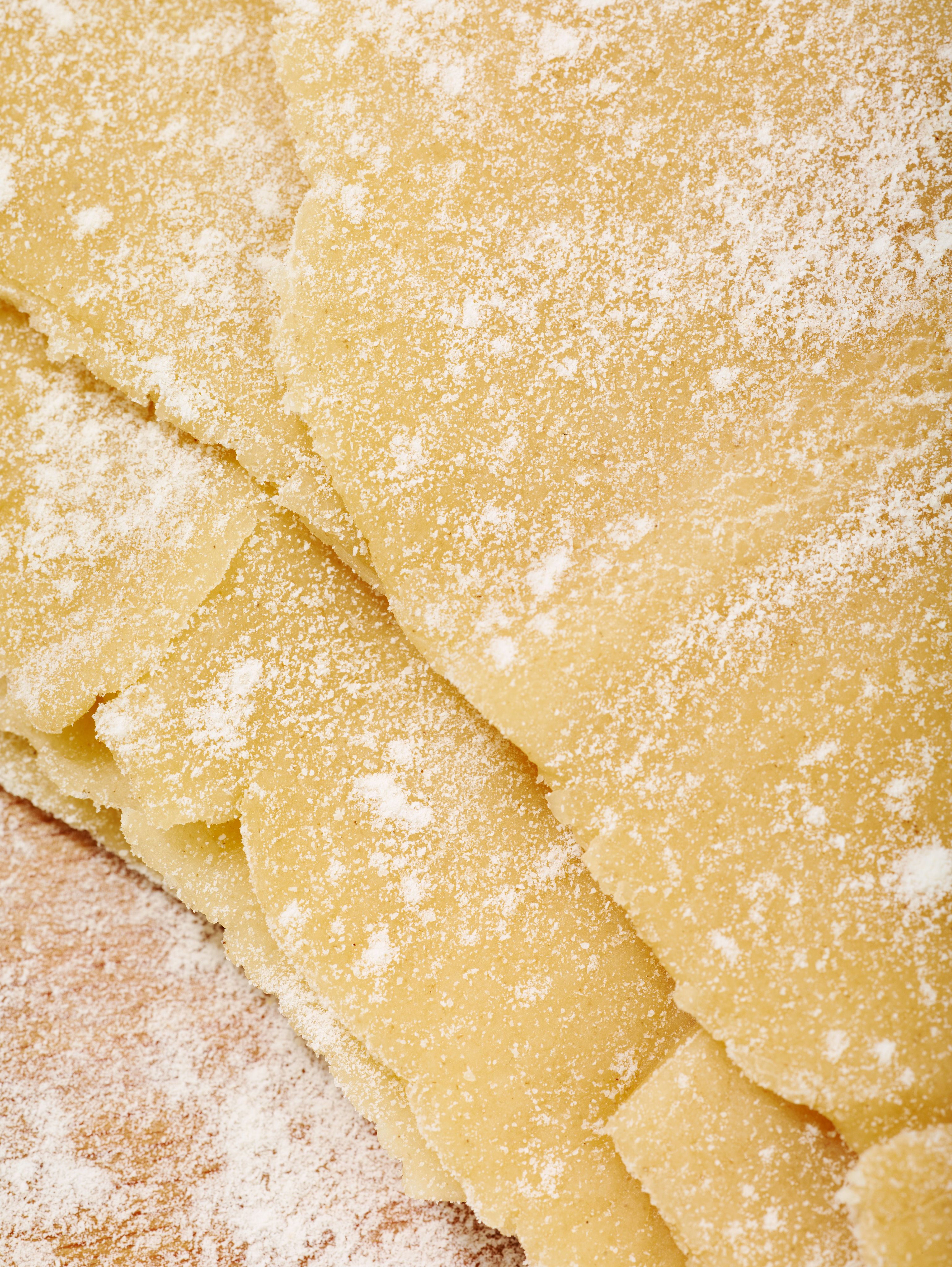 Flour coated sheets of pasta dough