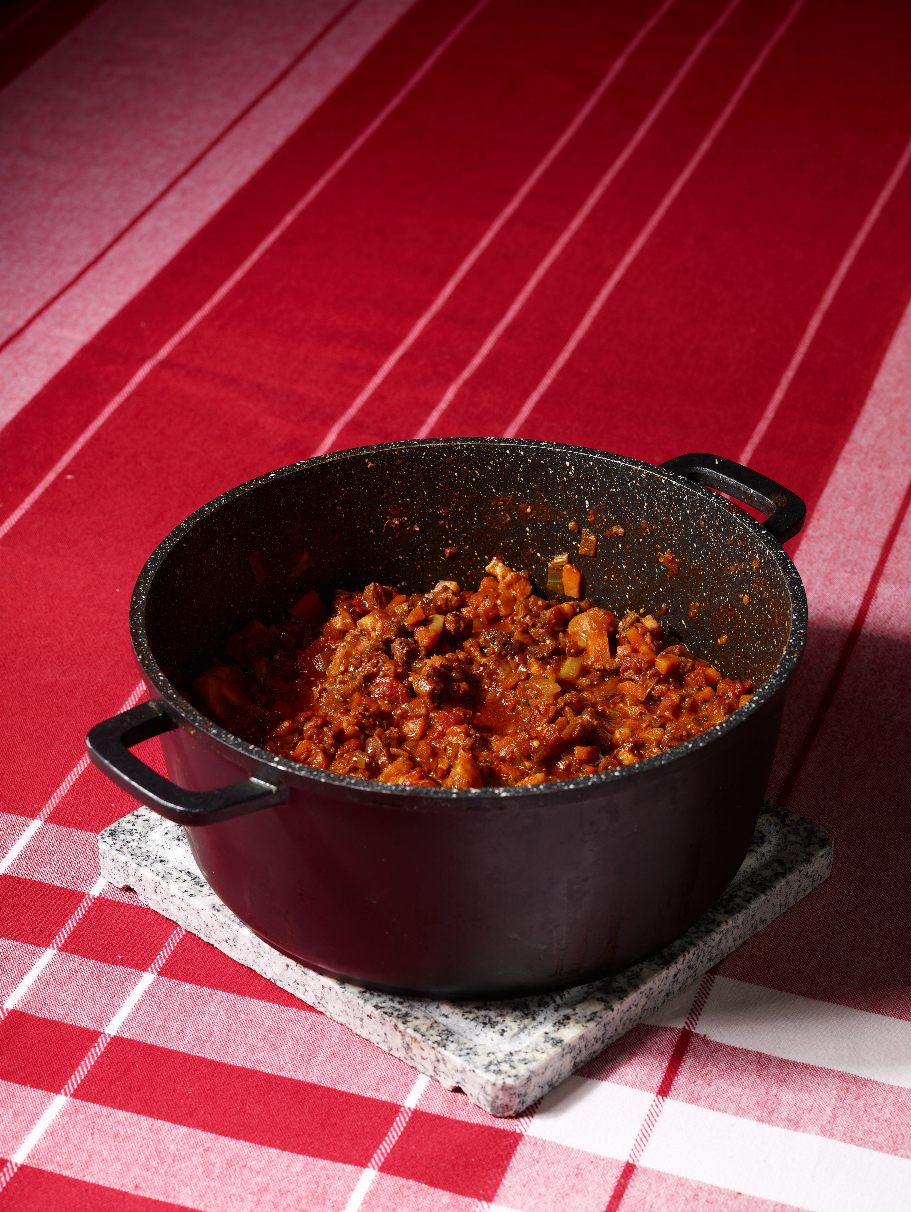 The finished ragù in a heavy pot