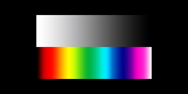 A synthetic image showing a white-to-transparent gradient as well as a color spectrum on a black background